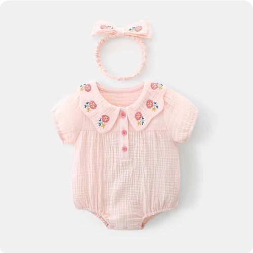 Pink baby romper with floral embroidered collar and matching bow headband.