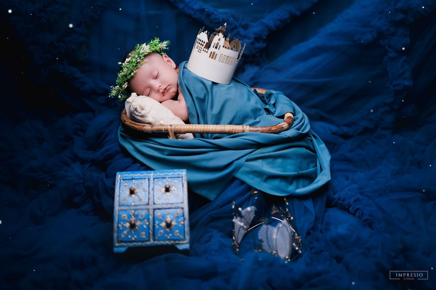 Baby sleeping on parent’s hands for emotional new born shoot – Impresio Studio