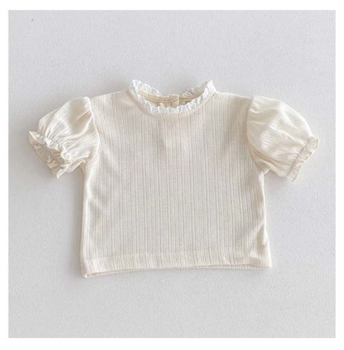 White cotton baby top with puff sleeves and ruffle collar detail.