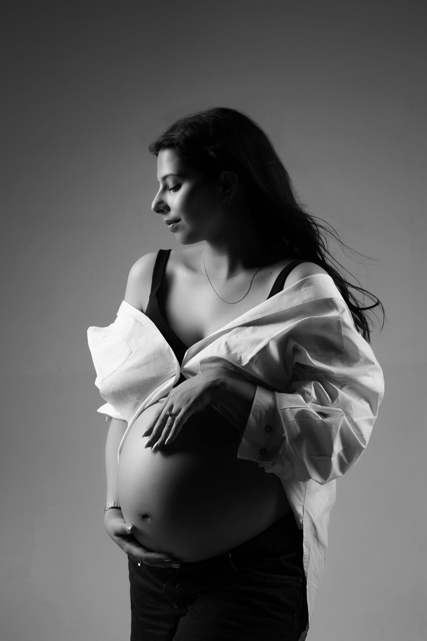 Black and white artistic portrait series showing graceful movement and flowing fabric in dramatic lighting.
