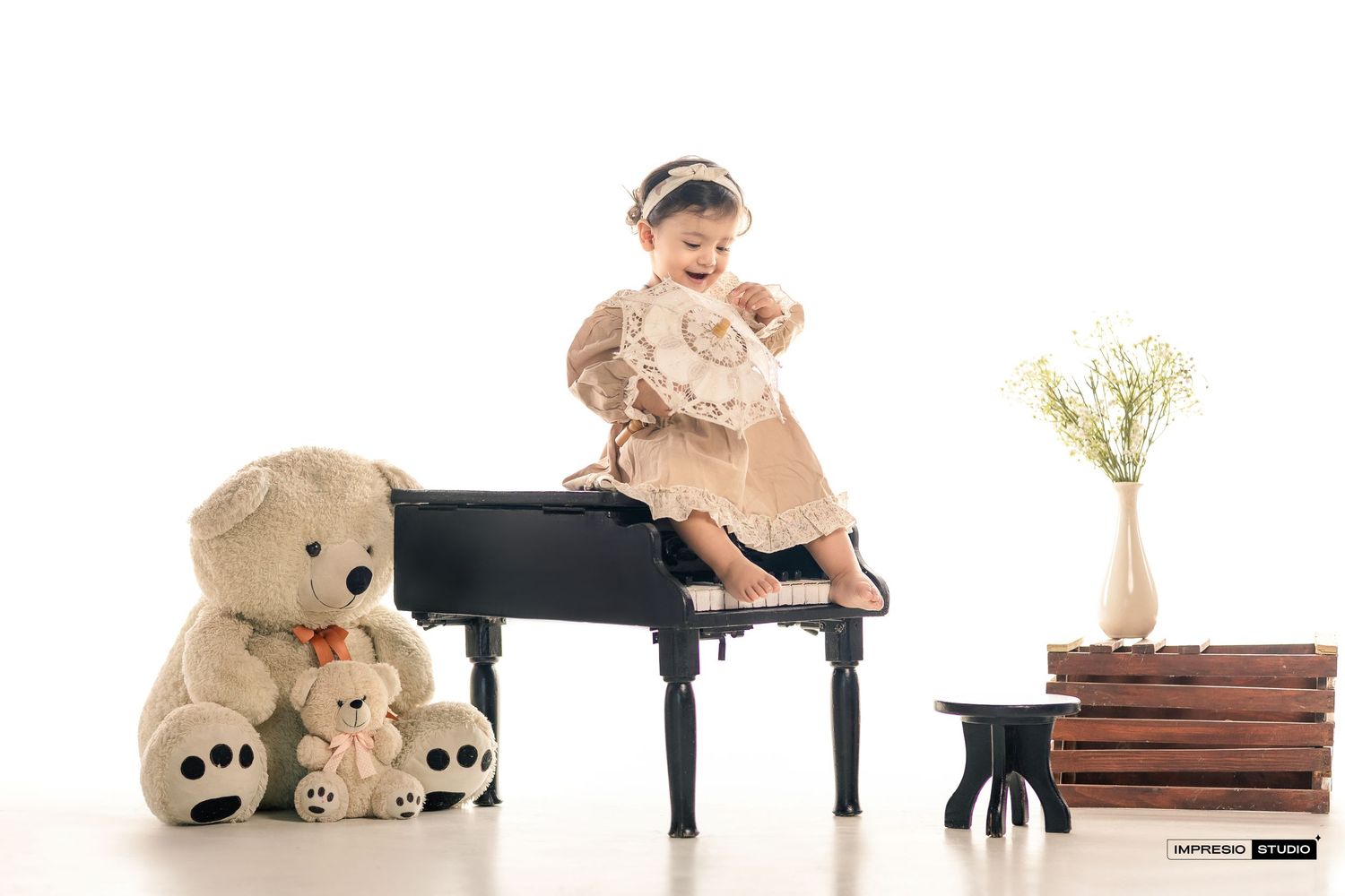 A panoramic collage of a child playing piano with teddy bears and books arranged in a horizontal sequence.