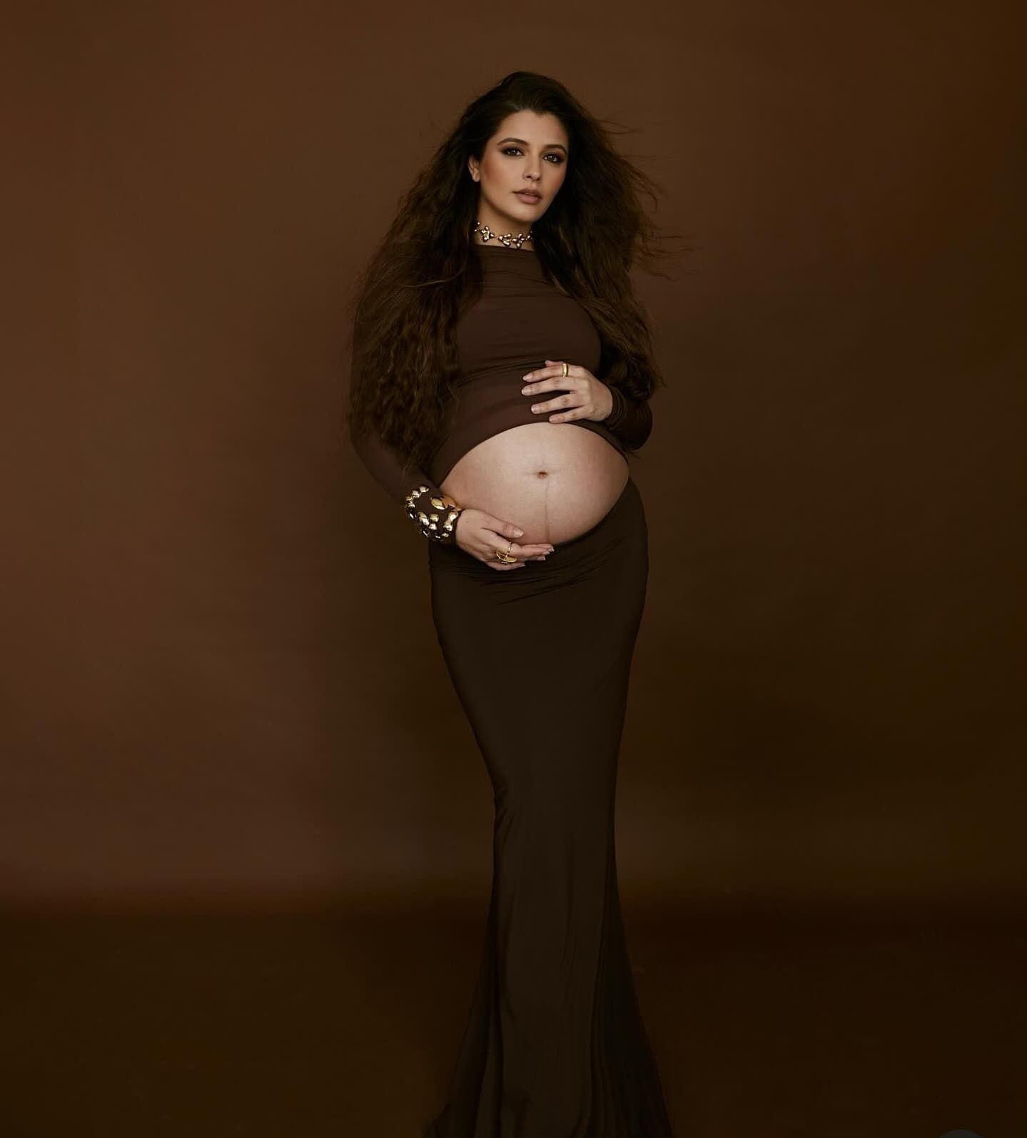 Artistic maternity portrait series in brown tones showing flowing dress and gentle poses.