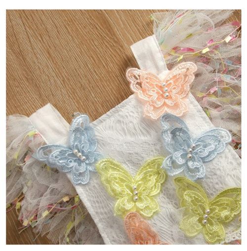 Delicate lace trim with colorful butterfly appliques in pastel blue, yellow, and peach.