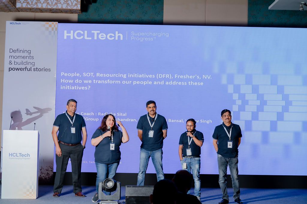 Five HCLTech employees present on stage at a corporate event discussing people and SOS resourcing initiatives.