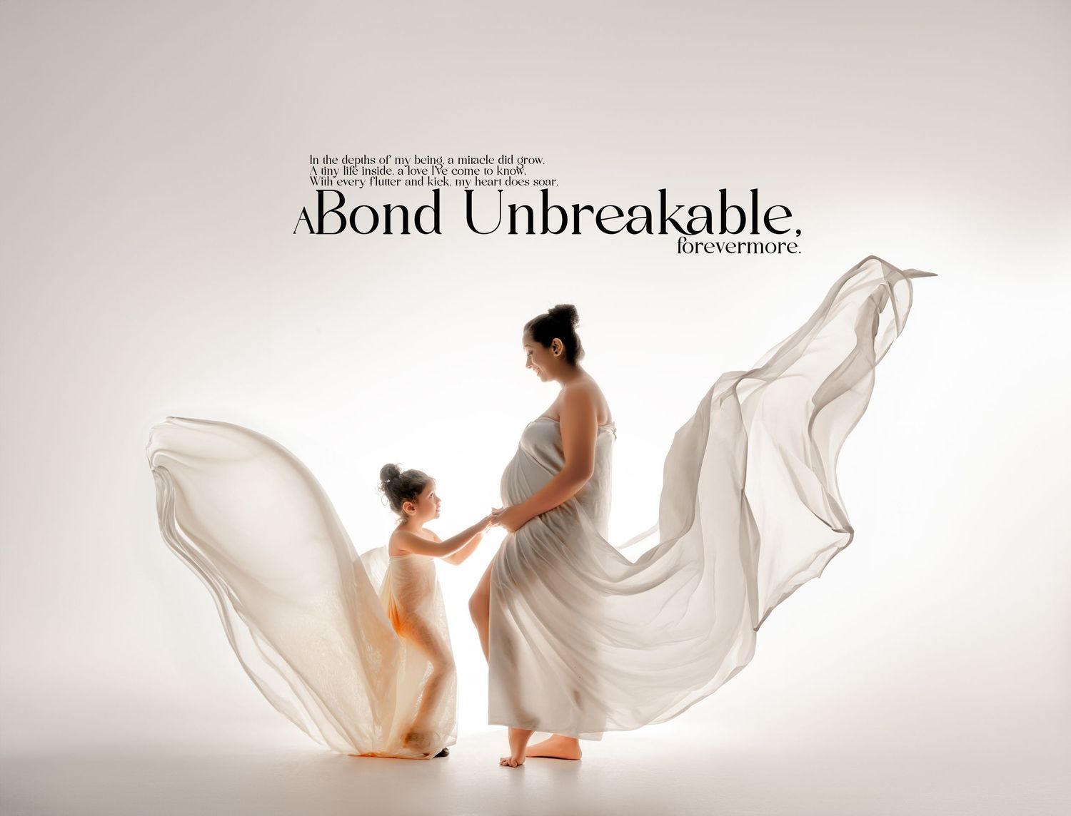 Silhouetted figures in flowing white fabric create ethereal maternity portrait emphasizing connection and movement.