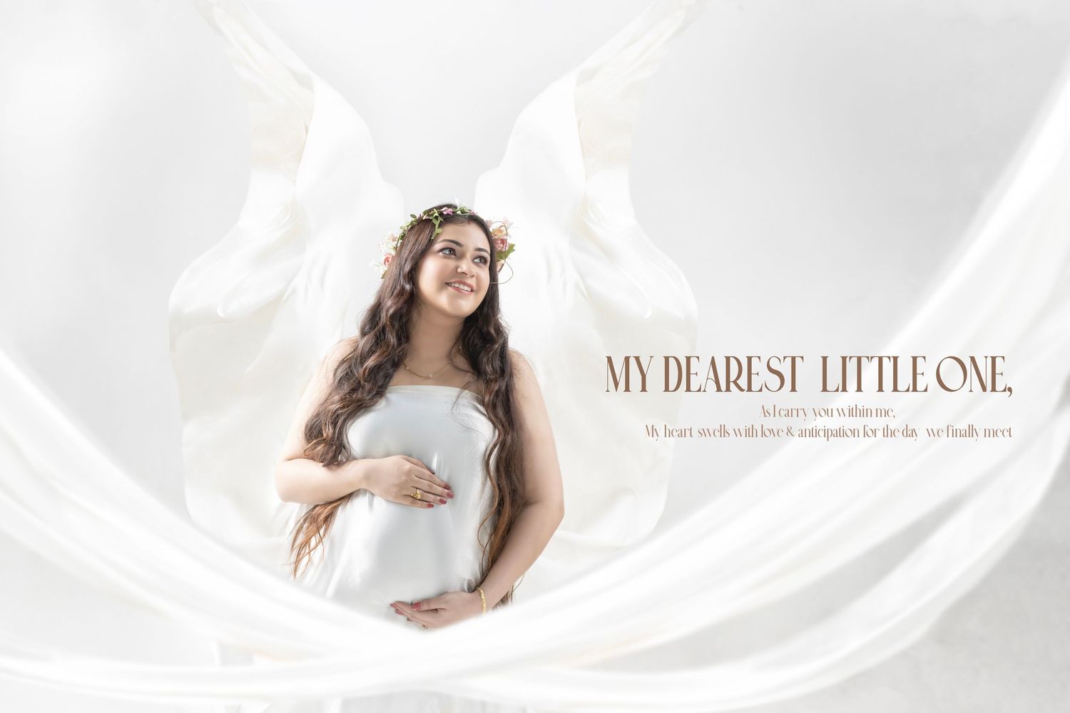 Delicate maternity photography banner with text overlay and soft draping fabric.