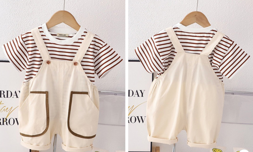Kids striped t-shirt with cream colored overall dress outfit.