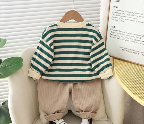 Green and white striped pajama set for children with matching shirt and shorts.