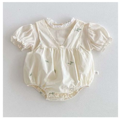 Vintage-style baby romper in cream with puff sleeves and floral embroidery.