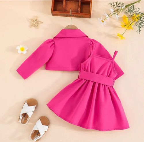Hot pink baby dress with full skirt and decorative bow detail.