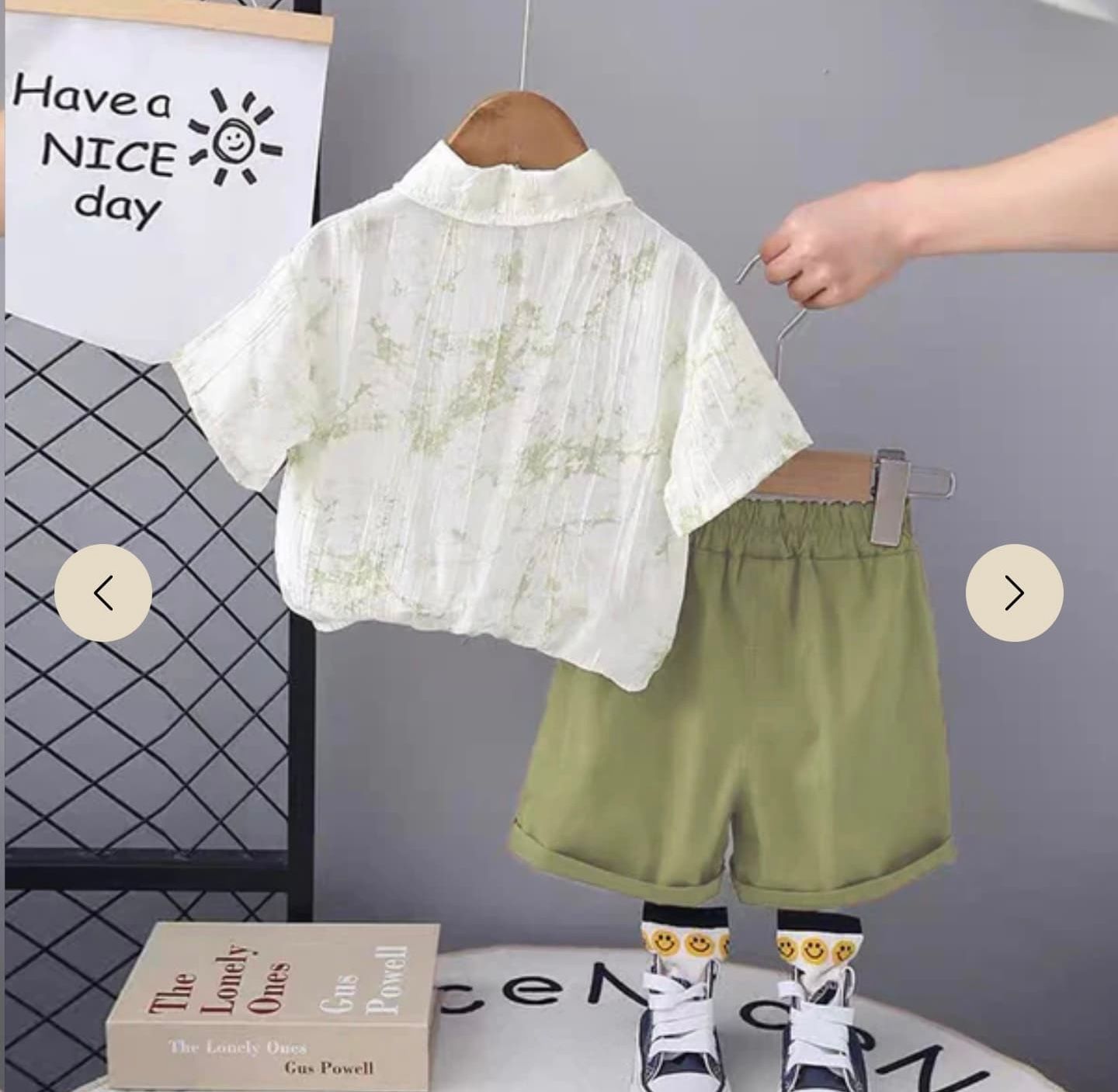 Casual summer outfit set featuring a white lace crop top and olive green shorts laid flat on display.