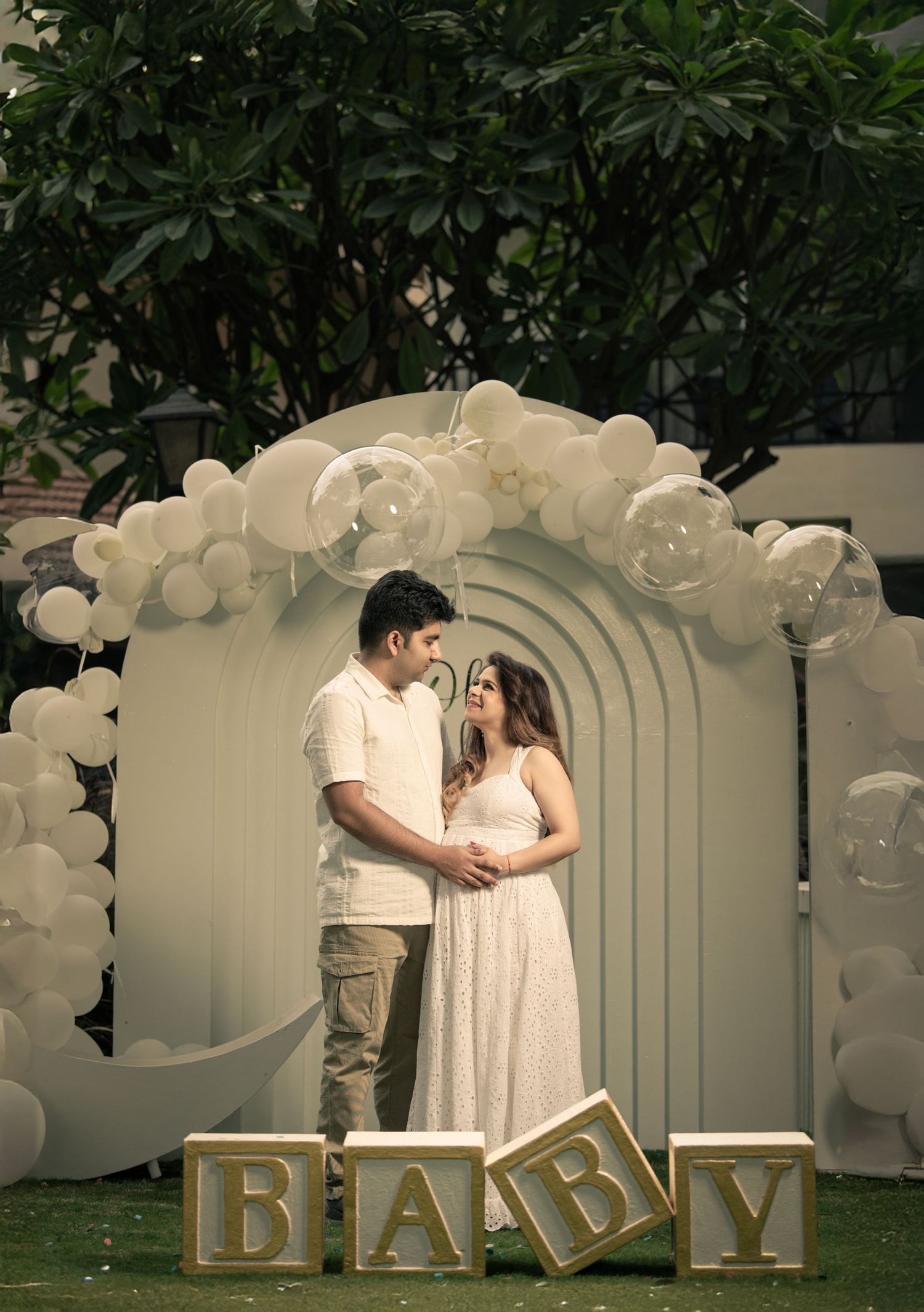 Baby shower photoshoot with floral backdrop by Impresio Studio
