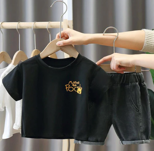 Black athletic tops displayed on clothing racks.