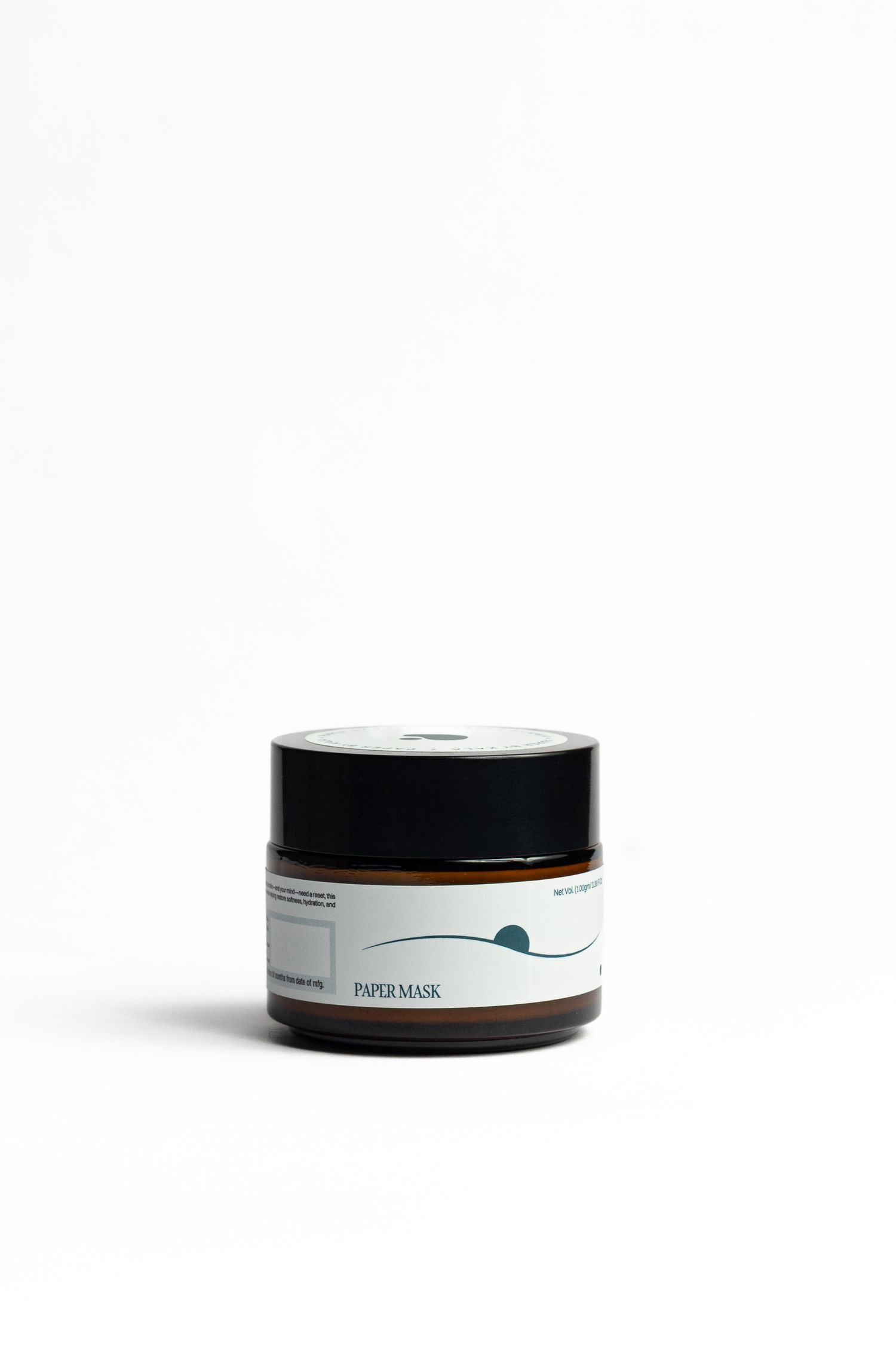 Small amber glass jar with a black lid and a label reading Paper Mask, shown against a clean white background.