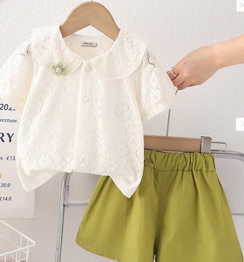 Children's summer outfit with white peter pan collar blouse and olive green shorts.