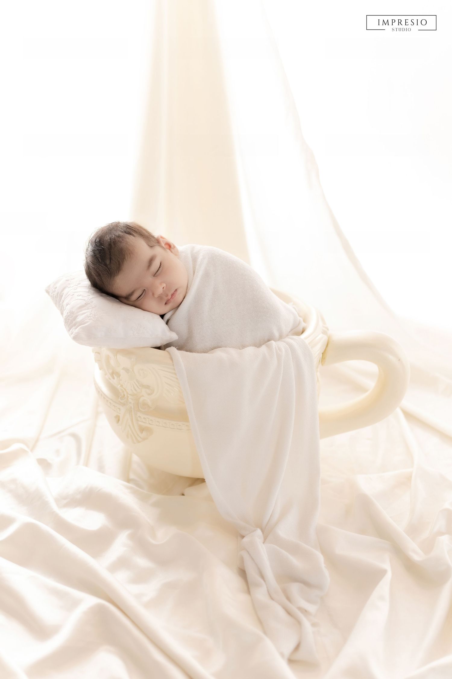 Baby sleeping peacefully during newborn photography session – Impresio Studio