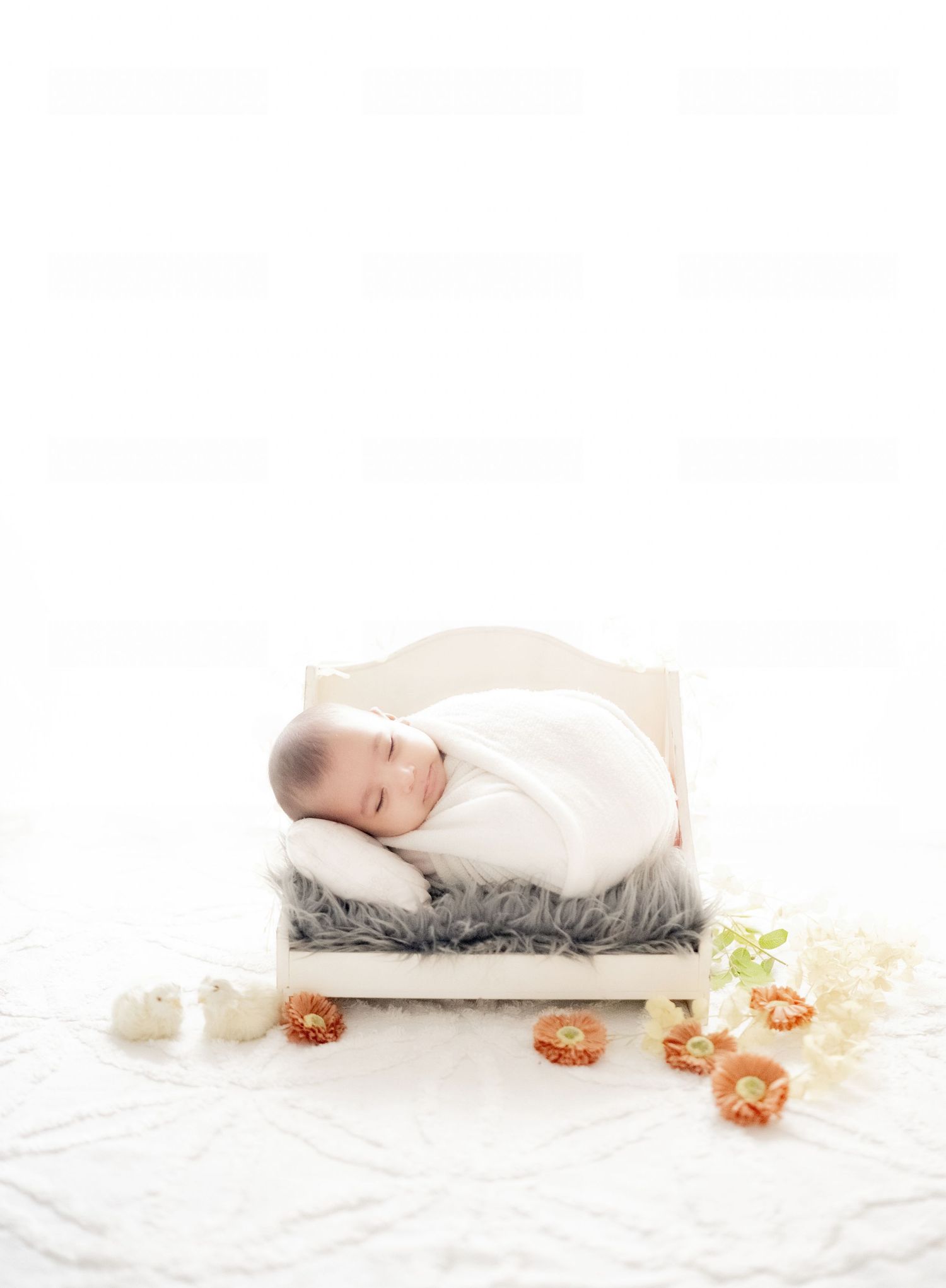 Baby boy in blue swaddle for professional newborn shoot – Impresio Studio