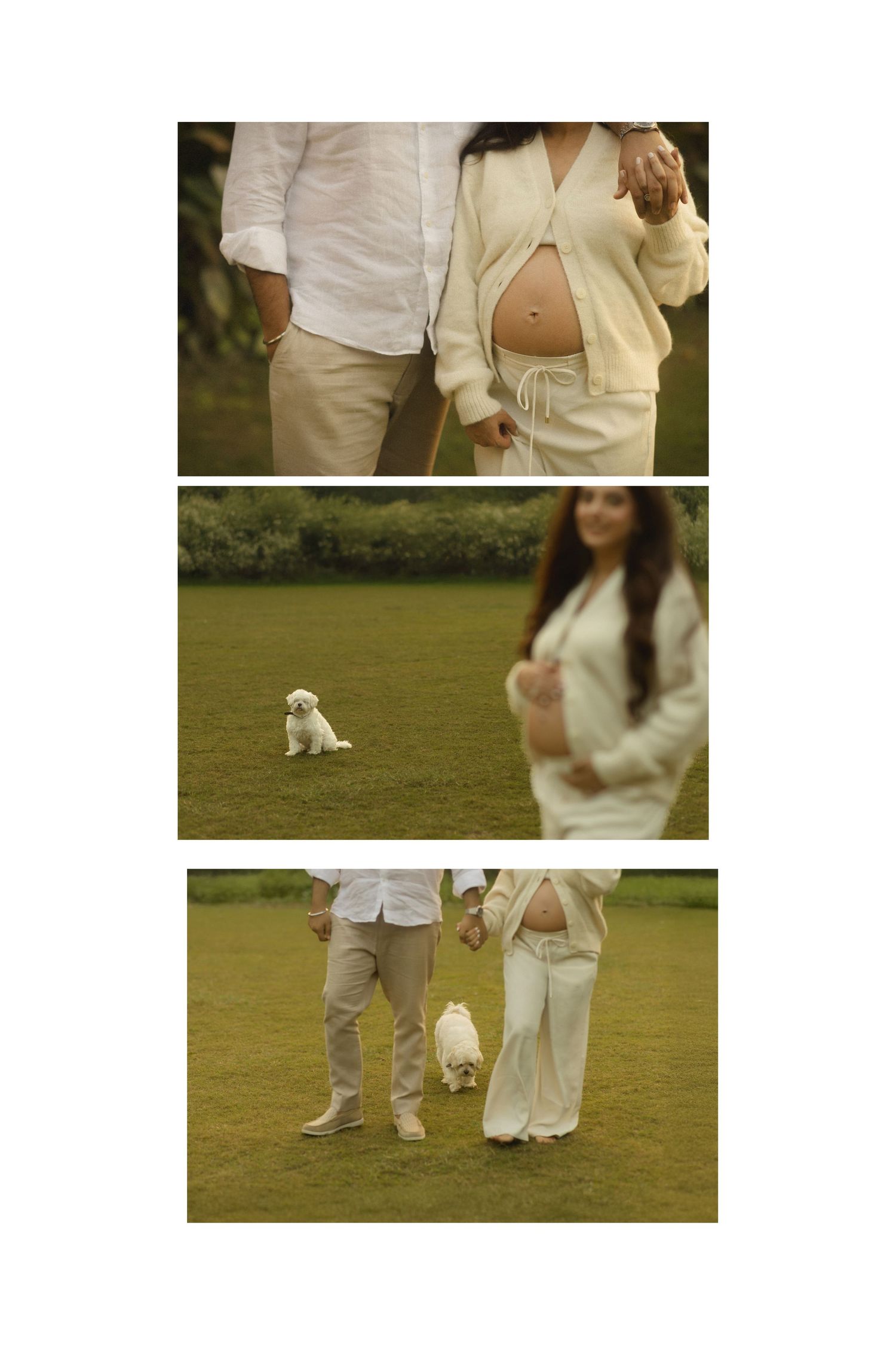 People in white outfits walking on green grass with a small white dog during an outdoor gathering.