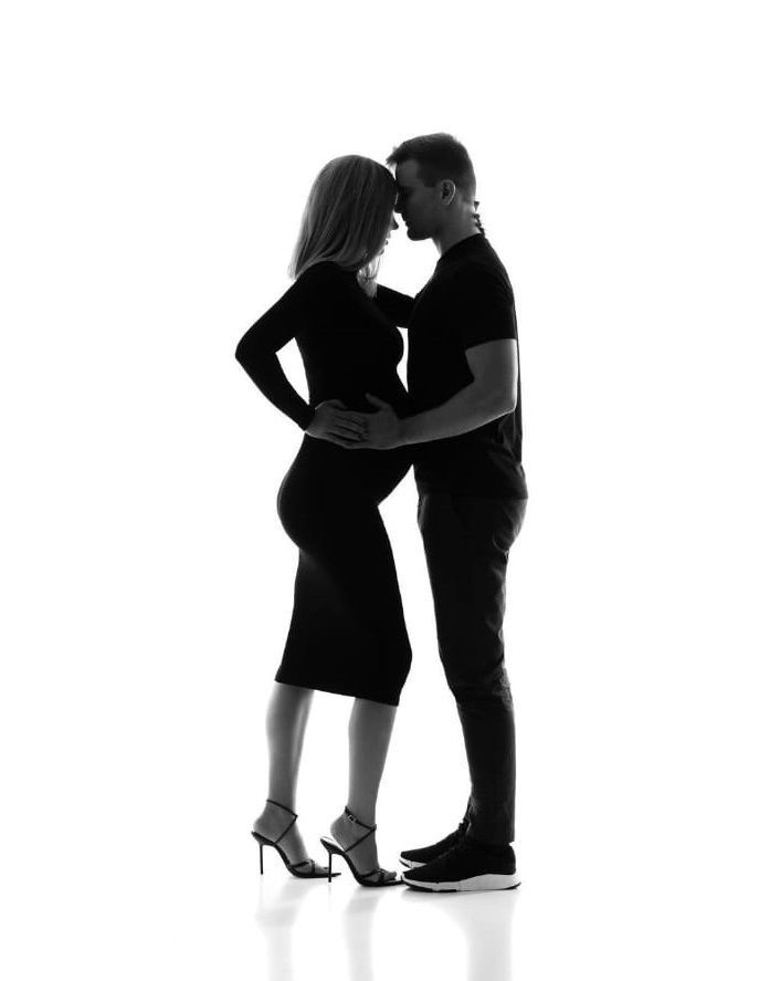 Romantic couple silhouette sequence showing intimate moments against white background.