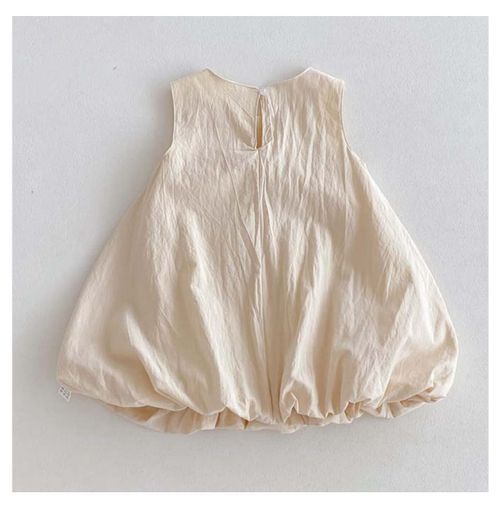 Simple cream colored sleeveless bubble dress with gathered bottom hem.