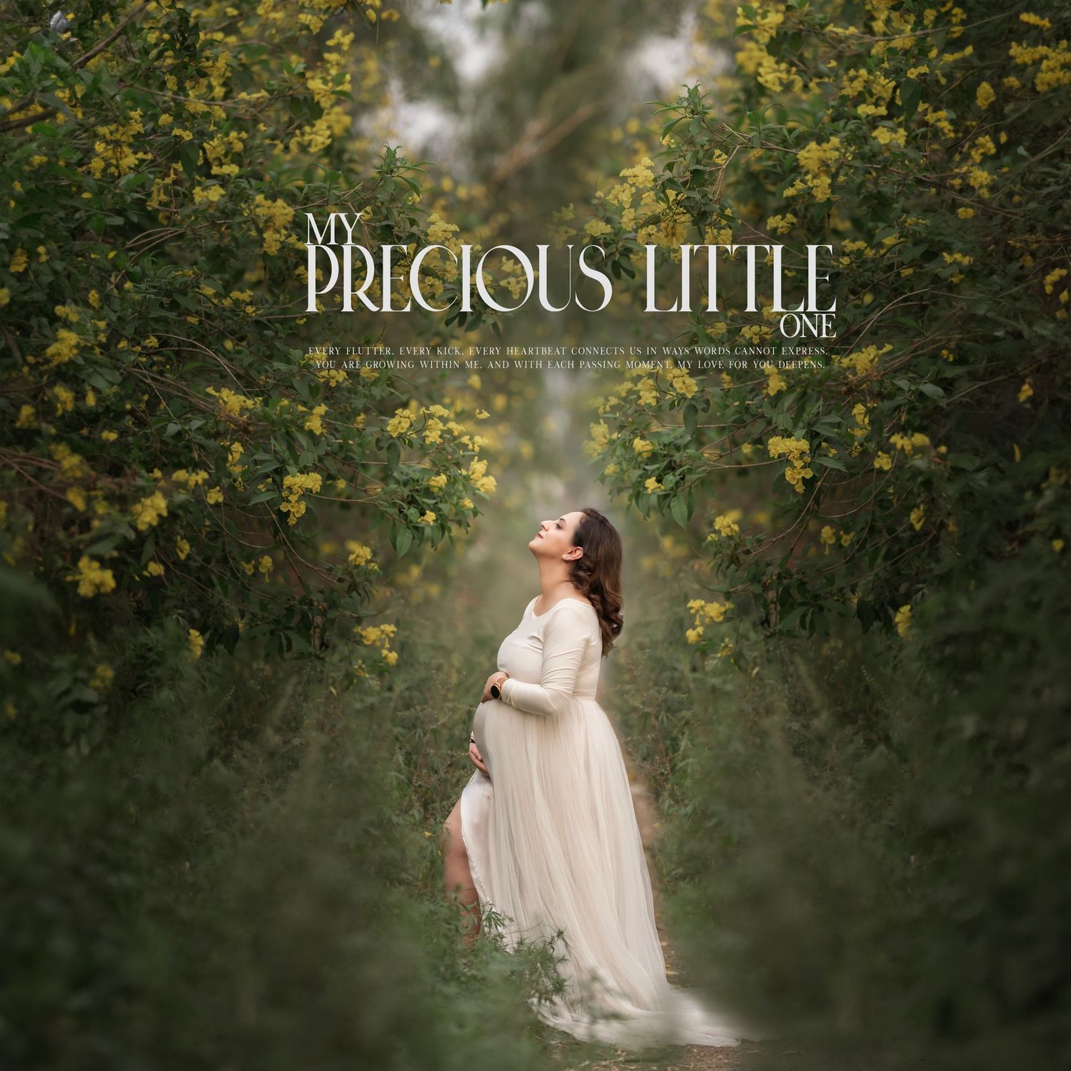Ethereal maternity photos in white dress surrounded by yellow flowering trees.