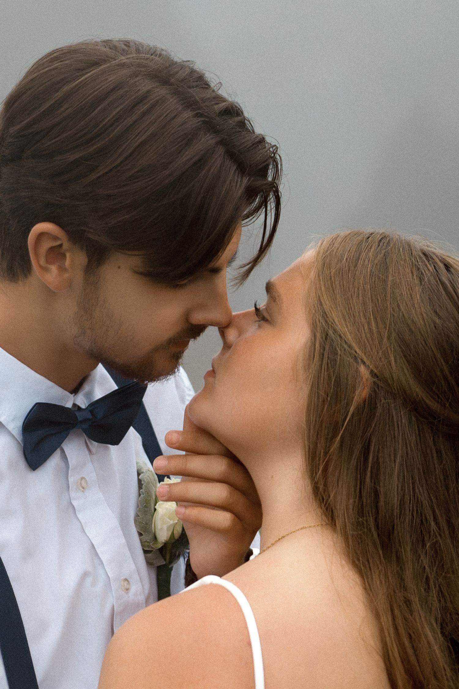 Intimate wedding portrait sequence showing tender moments between a couple in formal attire.