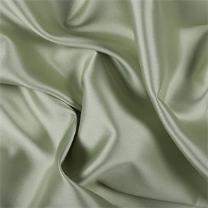 Luxurious sage green silk fabric with soft folds and wrinkles creating an elegant textured surface.