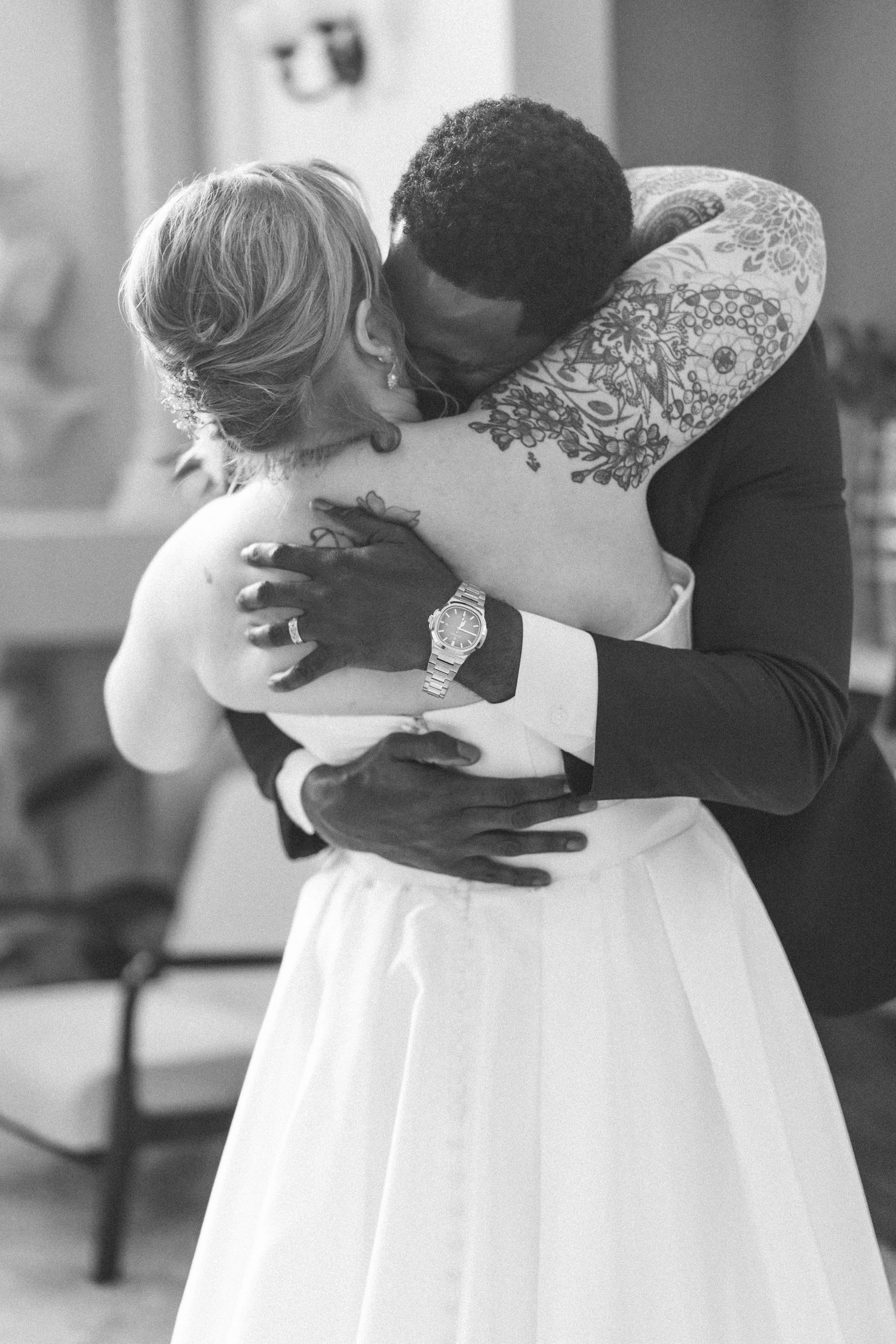 Black and white series showing an intimate embrace between newlyweds.