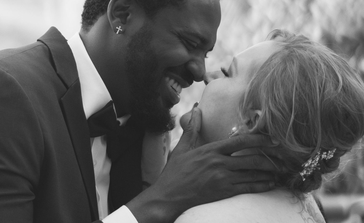 Black and white intimate wedding portraits captured in soft lighting.