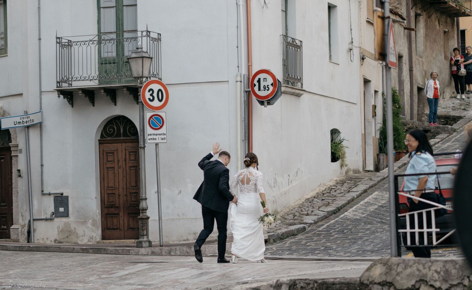 A sequence of wedding photos showing a couple walking through cobblestone streets of an old Italian town.
