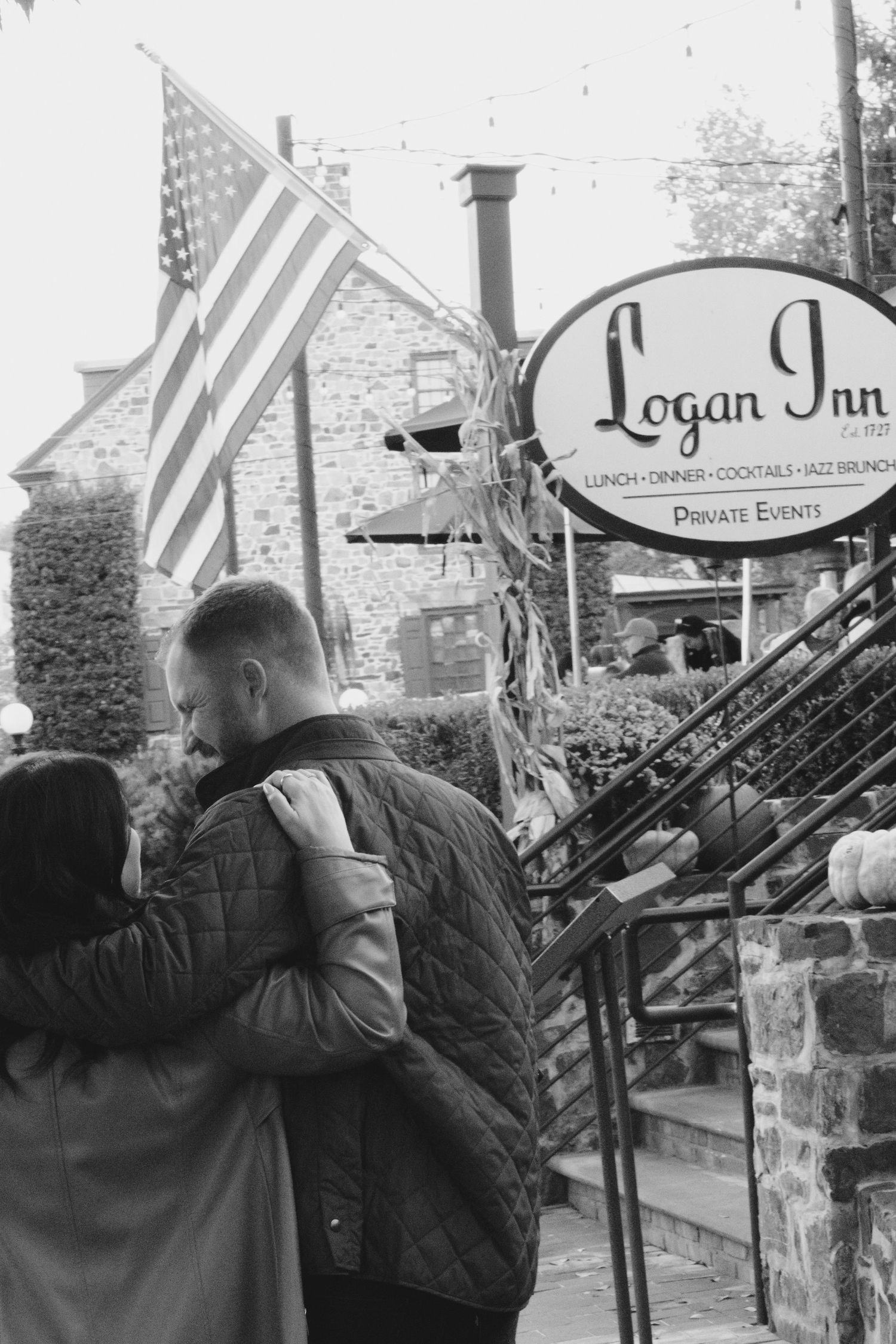 A sequence of black and white photos showing two people embracing outside a storefront with a Logan Inn sign.