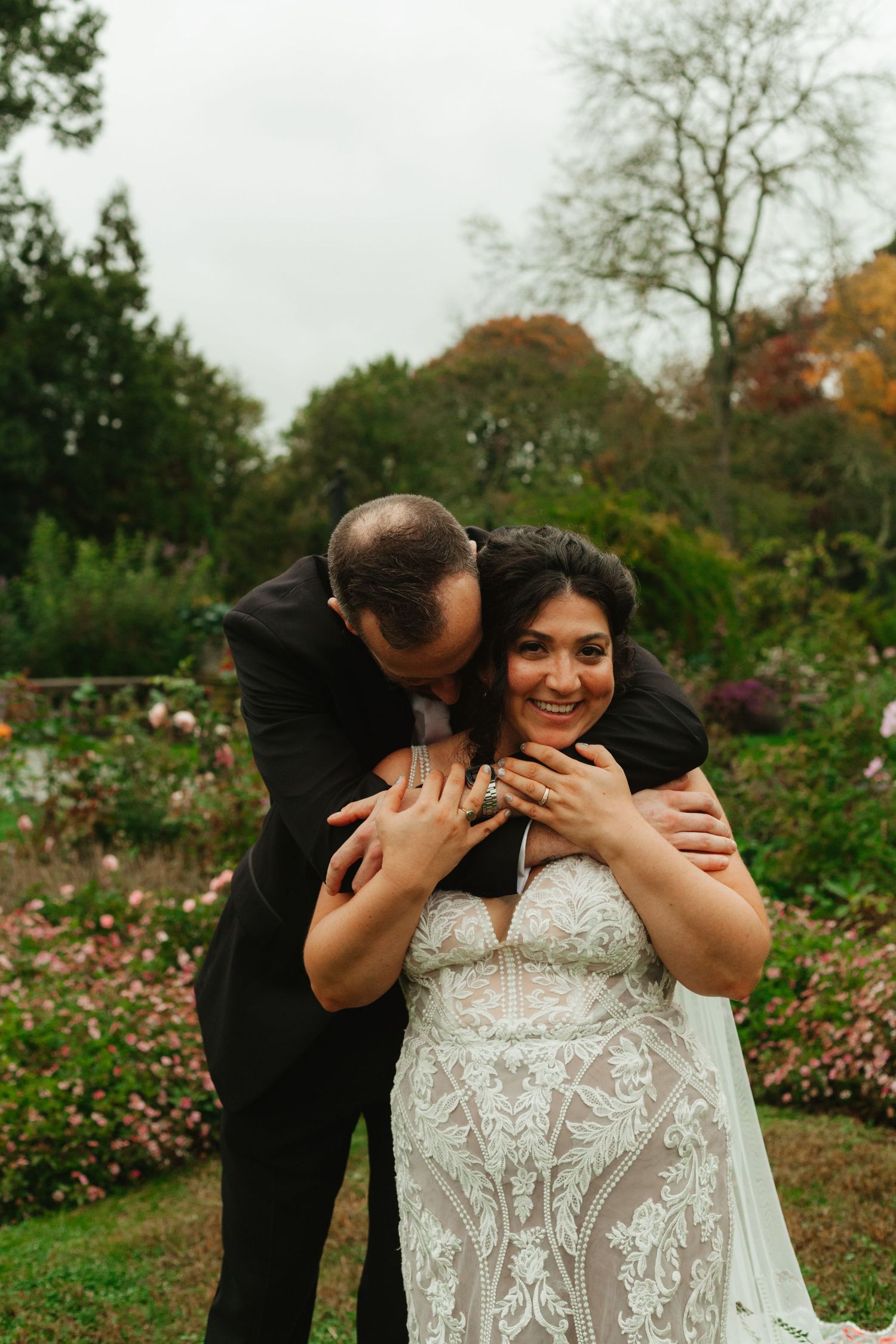 A romantic sequence of wedding photos shows a couple sharing tender moments in a lush garden setting.