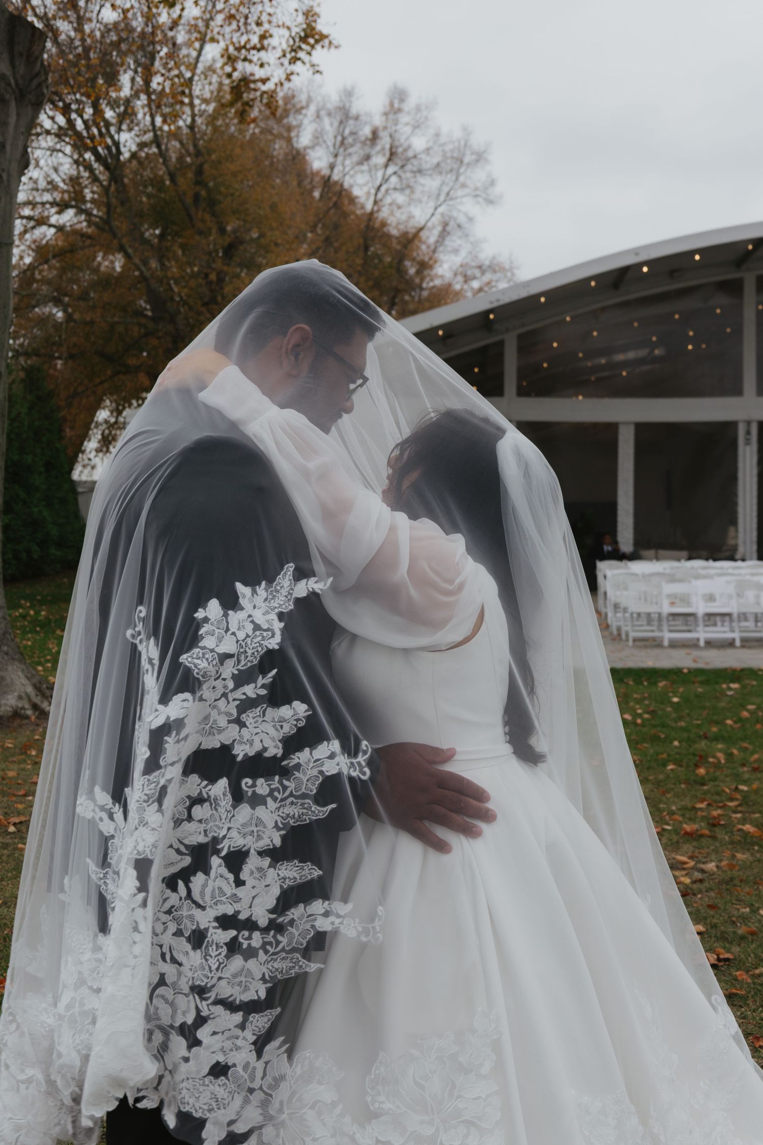 A romantic wedding scene with flowing white veil and dress captured in a series of intimate moments outdoors.