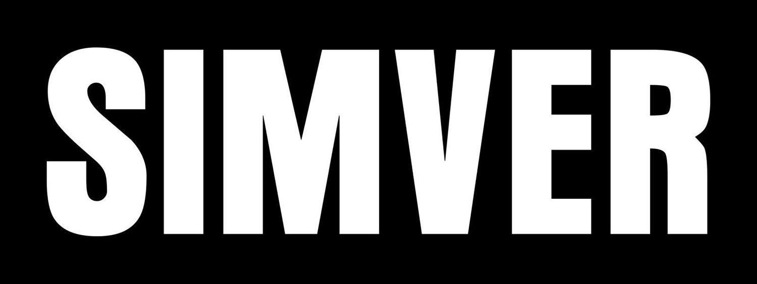 Three metallic silver text signs repeating the word SIMVER against a dark background.