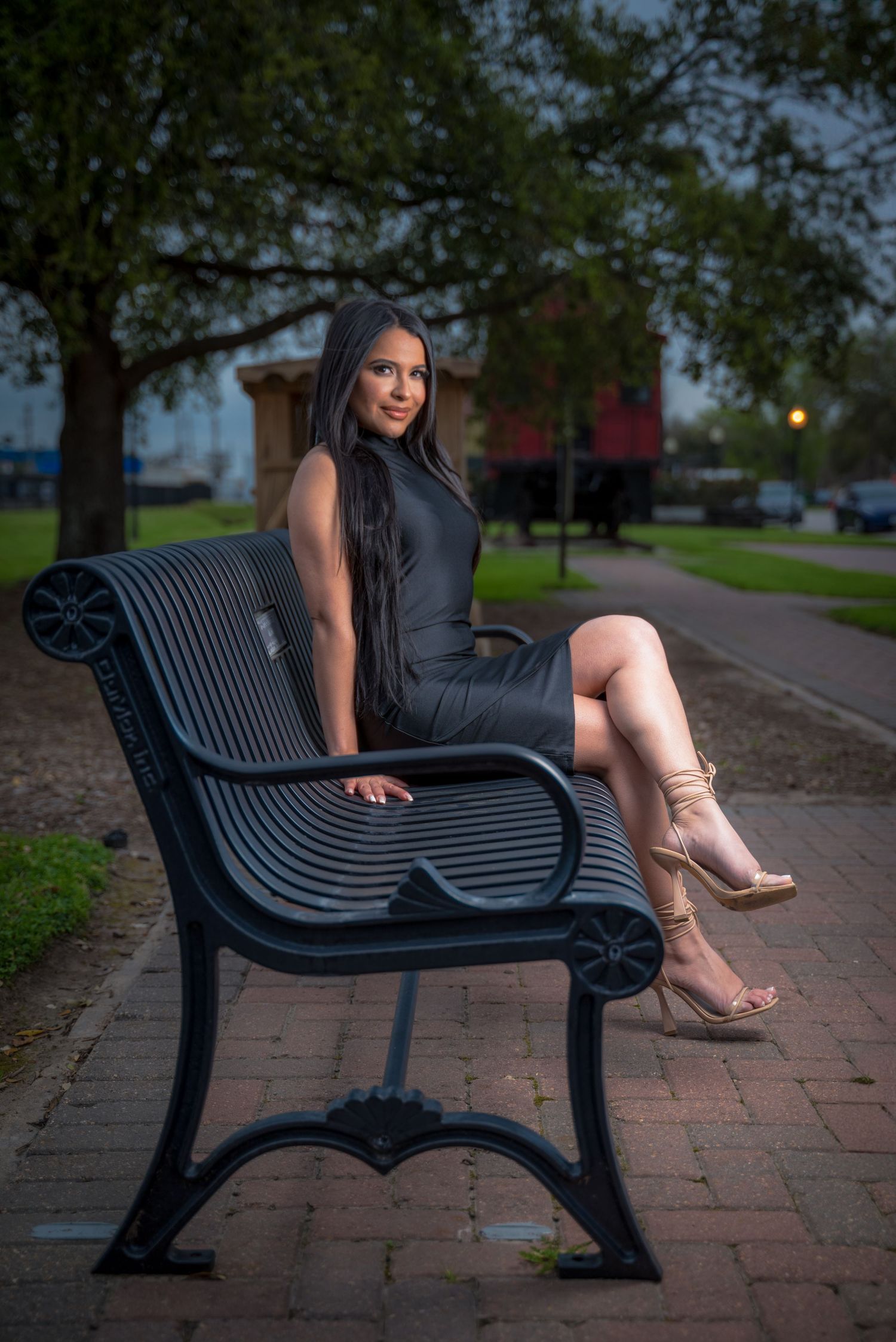 Fashion model posing in Old Town Katy, Texas, wearing a stylish outfit in a charming urban setting.