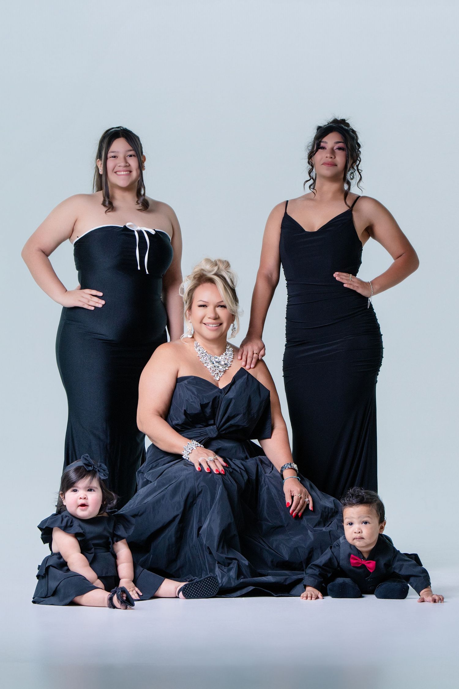 A progression series of studio portraits showing groups posed in elegant black dresses against a white background.