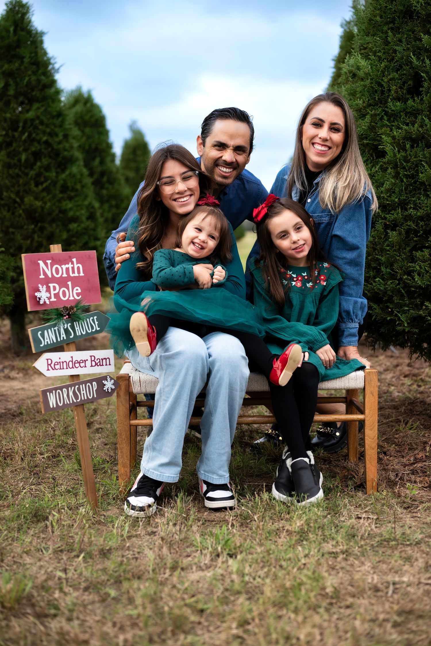 Christmas family portrait taken in Houston, Texas, featuring coordinated holiday outfits and festive decor. Perfect for seasonal memories, h