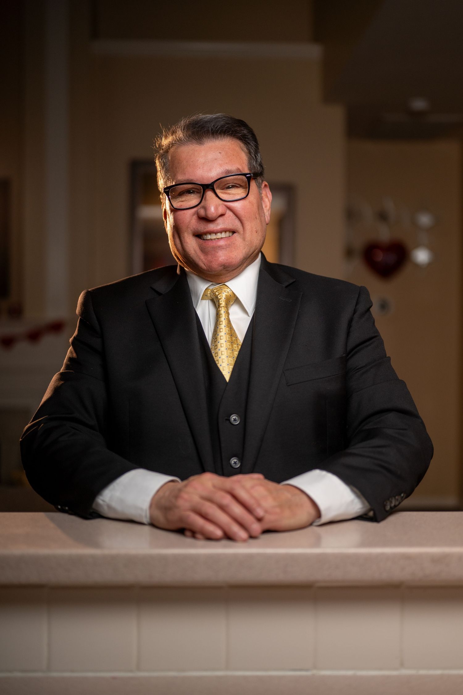 At-home male portrait using flash lighting—sharp, bold, and full of personality.