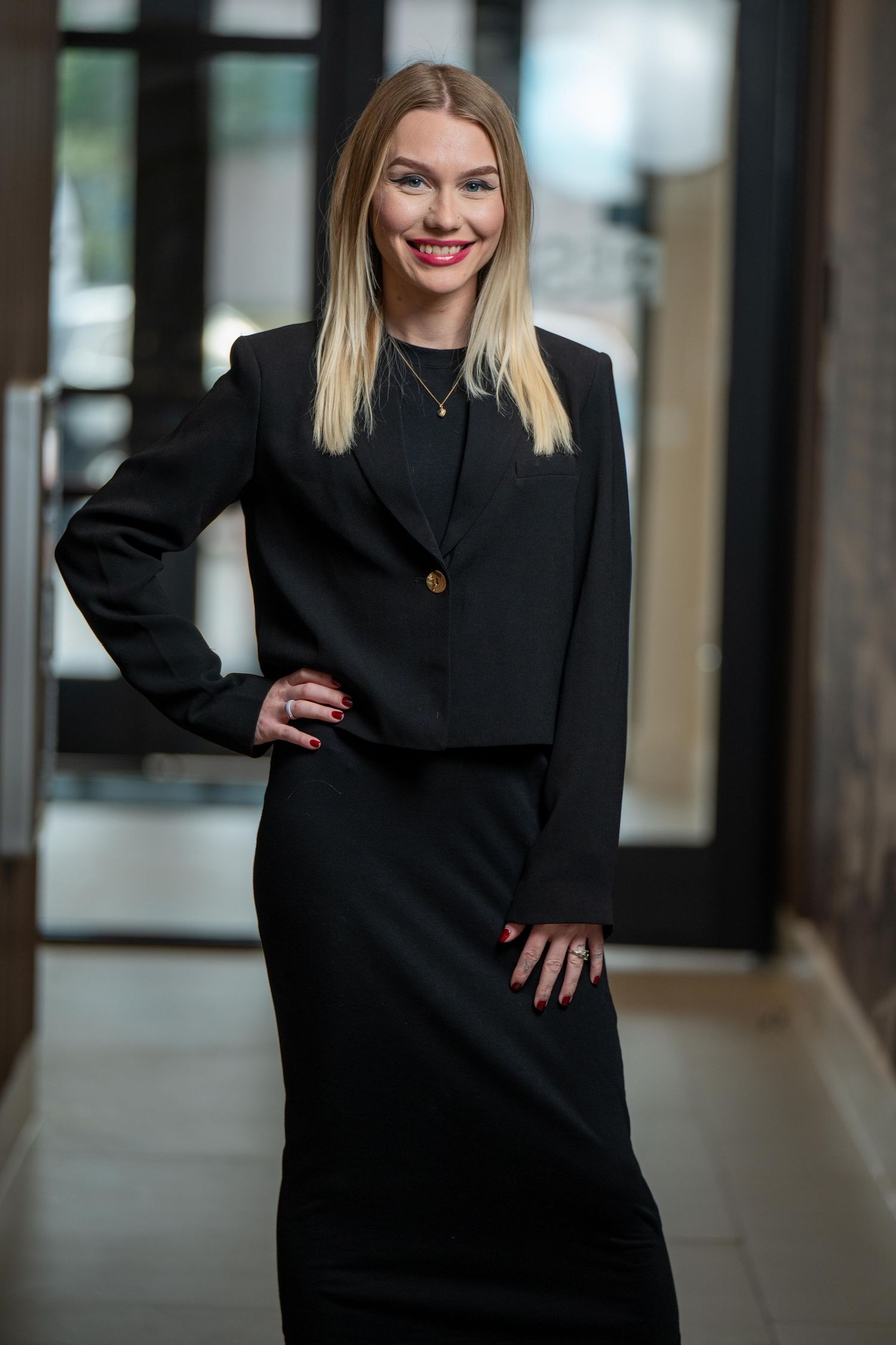 Leasing office manager in Houston posing for a professional portrait at the property.