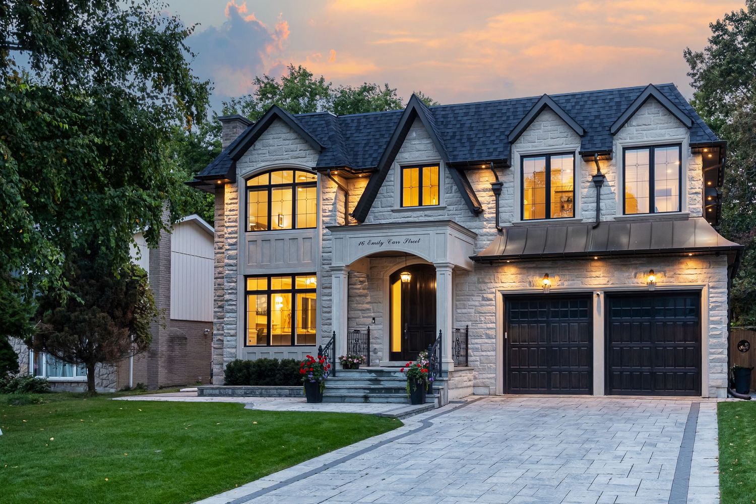 Luxury real estate photo at golden hour with dramatic twilight sky