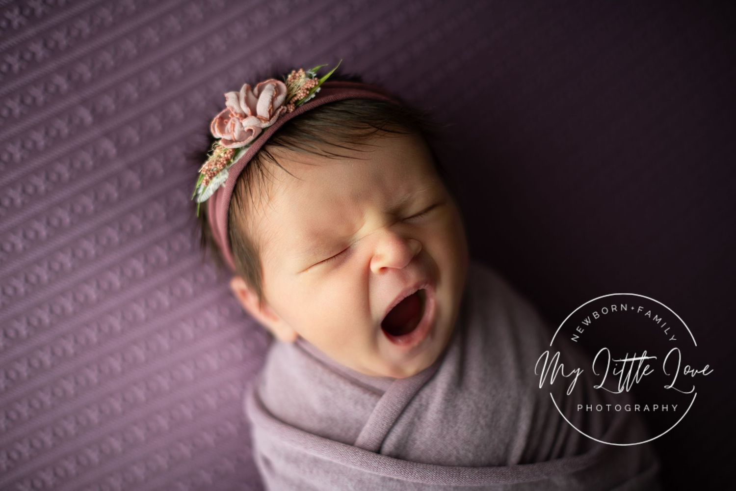 Professional newborn photo collage featuring purple tones and sleeping baby in various poses.
