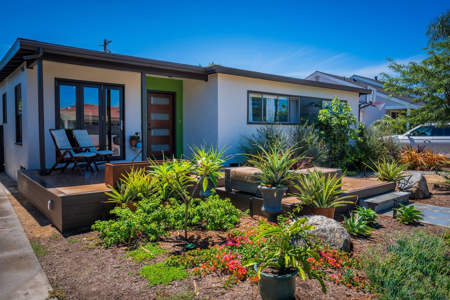 Modern house exterior with drought-resistant landscaping and clean architectural lines.