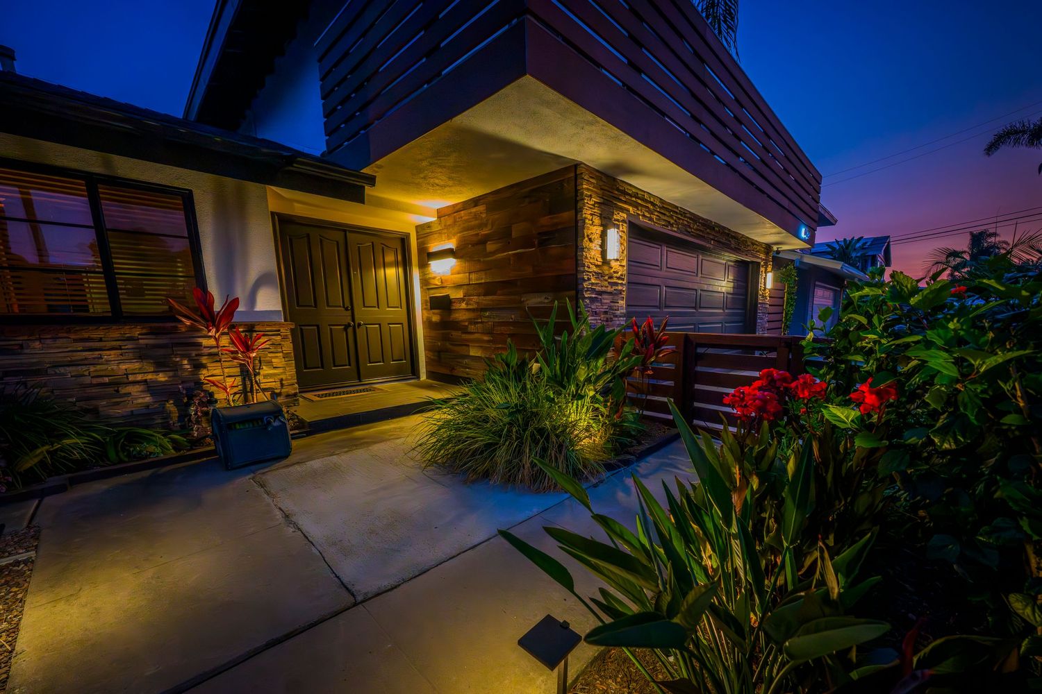 Exterior architectural shots of a house at dusk with ambient lighting.