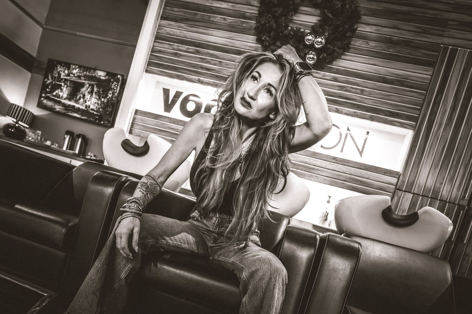 A black and white photo collage showing multiple poses and expressions in a vintage style setting.