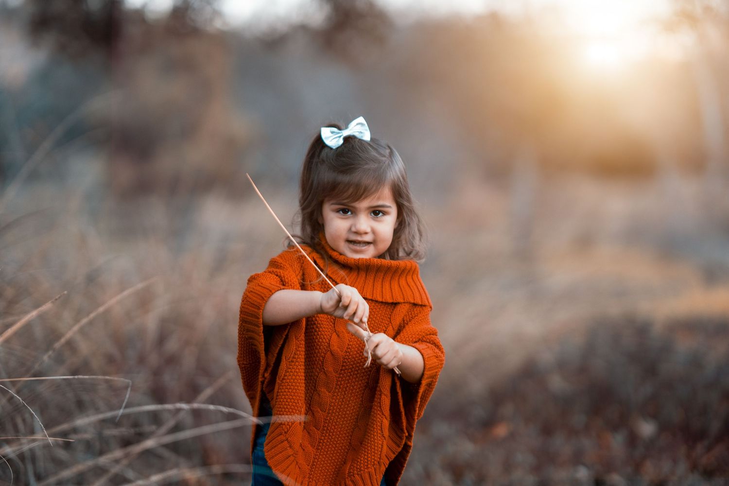 A warm-toned fall photoshoot featuring rustic autumn colors and outdoor scenery.