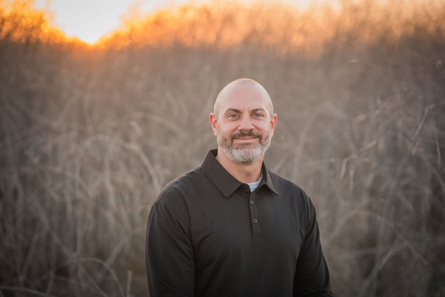 A series of outdoor portrait photographs taken at sunset with warm golden lighting and natural field backdrop.