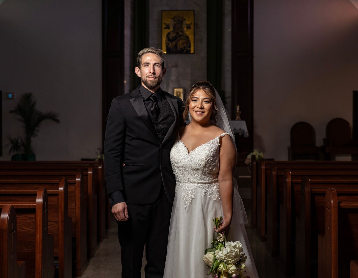 Elegant church wedding ceremony with a couple exchanging vows at the altar.