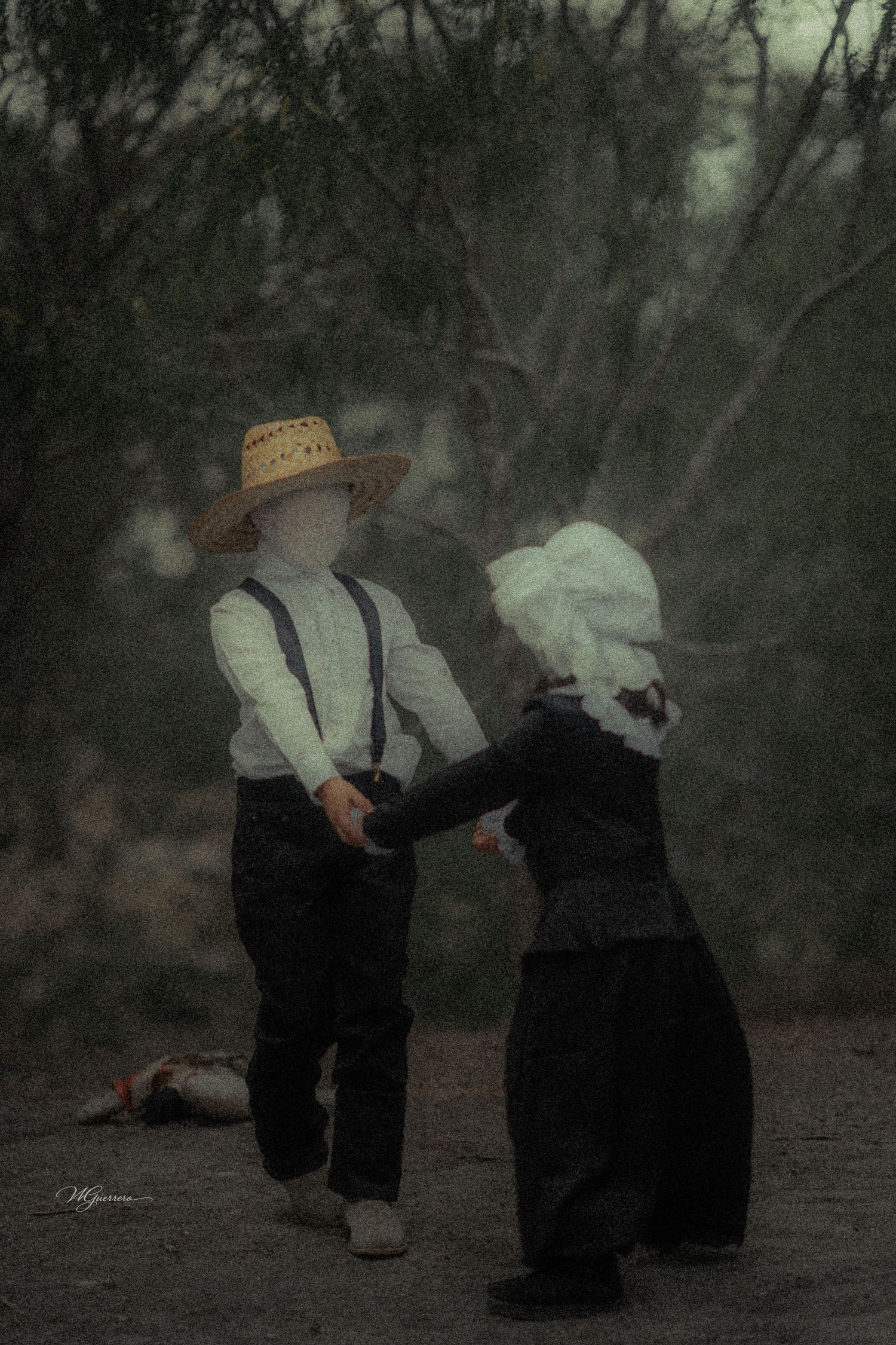 Two faceless Amish children in traditional dress holding hands outdoors in a dark, atmospheric scene.
