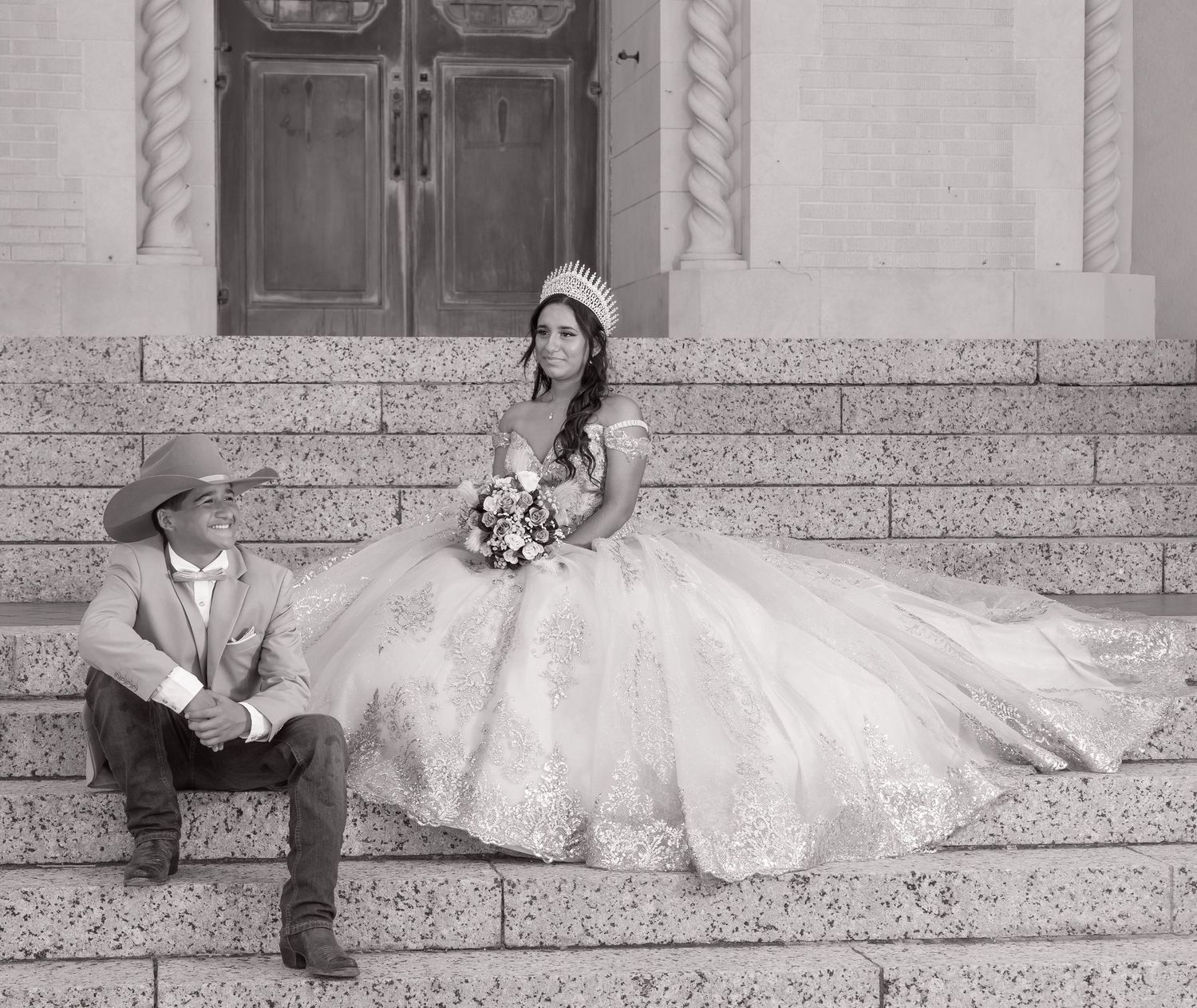 A series of black and white photos showing a person in a wedding dress reclining on stone steps in different poses.