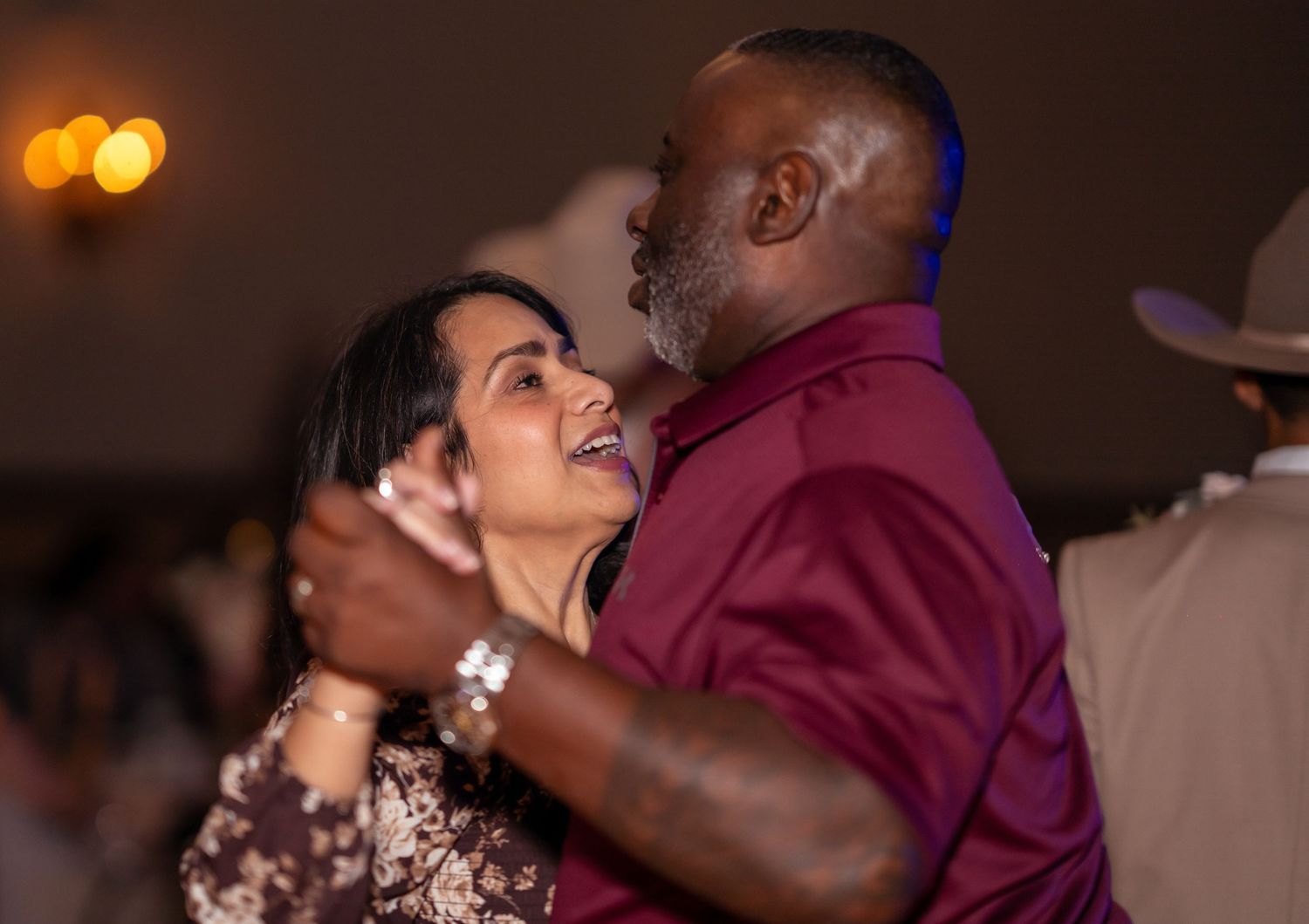 Couple shares a romantic dance together at a formal evening celebration event.